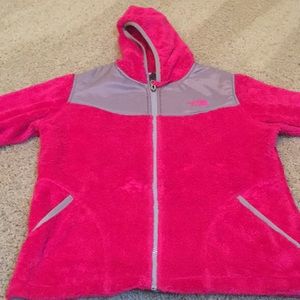 A pink fuzzy North Face jacket